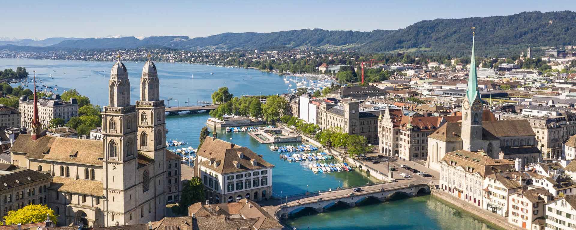 A panoramic view of Zurich city in Switzerland, showcasing the skyline, historical buildings, and the scenic landscape.