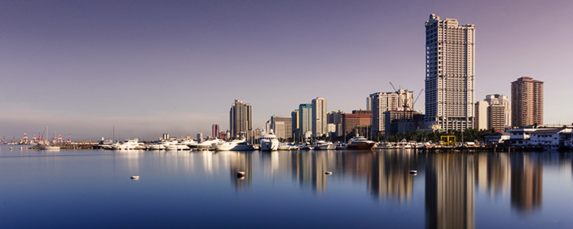 Cityscape mirrored in water, showcasing a beautiful reflection of the city.