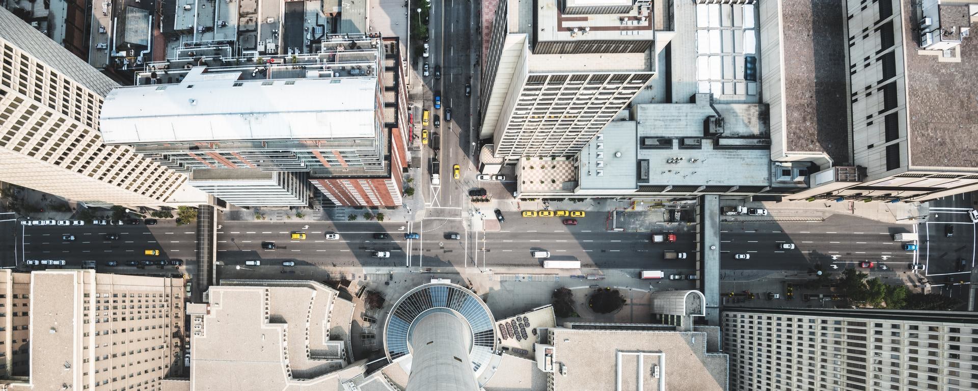 An image of a canadian street from above with vehicles.