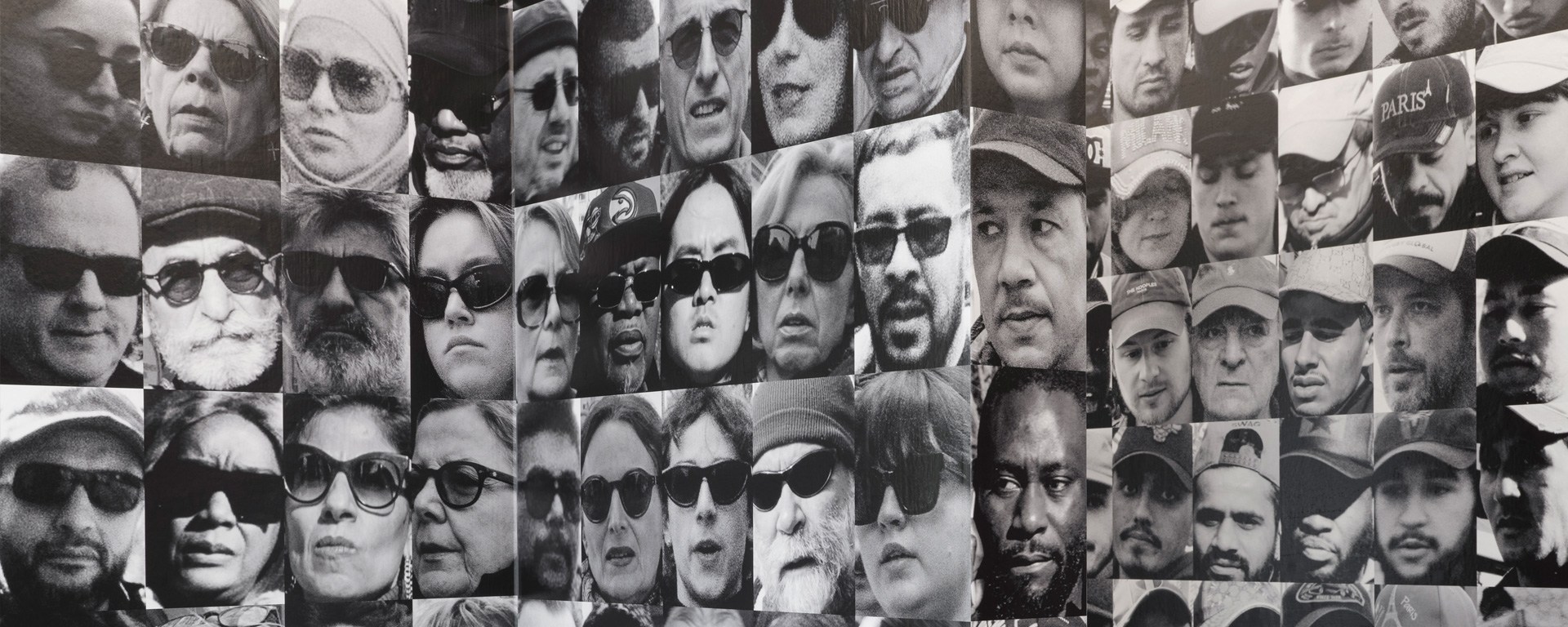 A photo of various portraits printed on different columns.