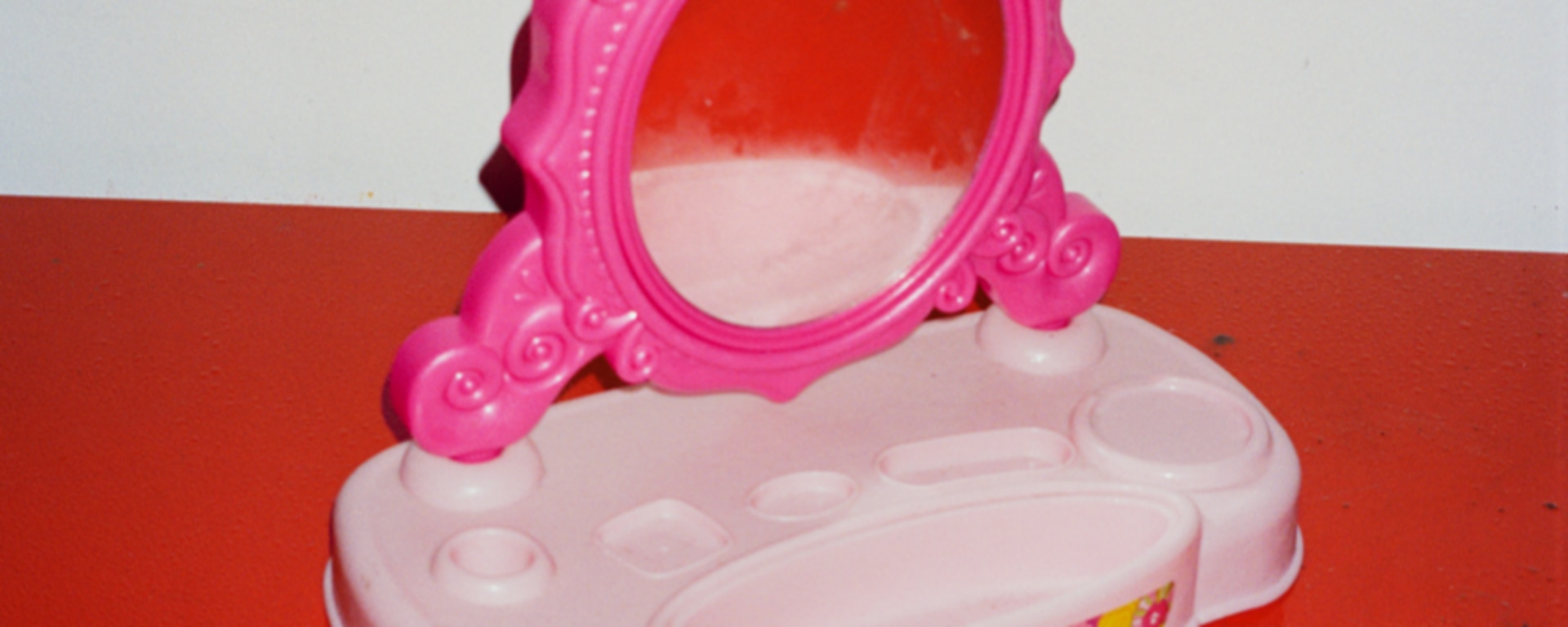 Photo of a kids play mirror on a plastic stand