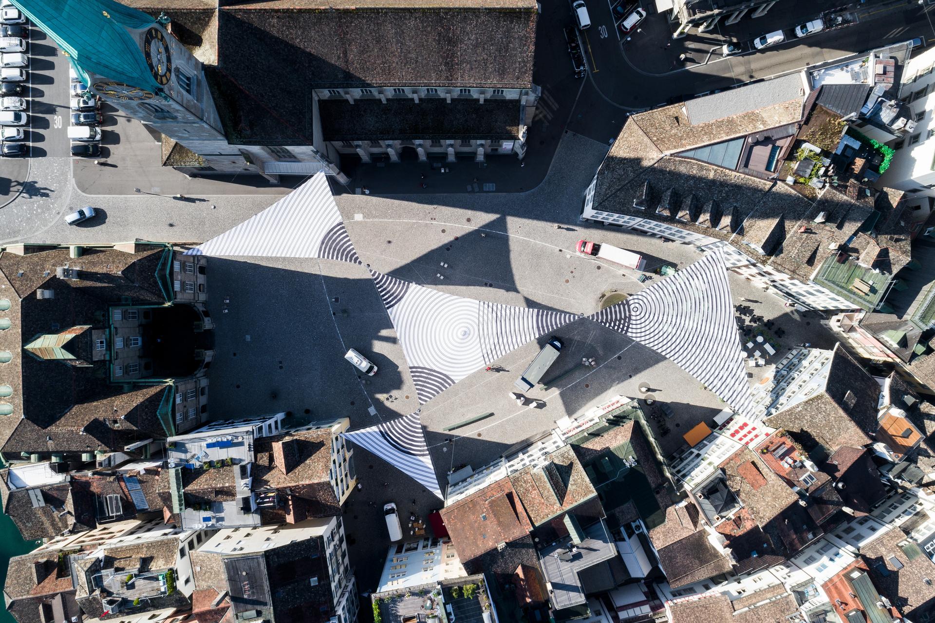 Photo of a city from a bird's eye view. Symbolic image for the use of data analytics as a central element in transaction banking.