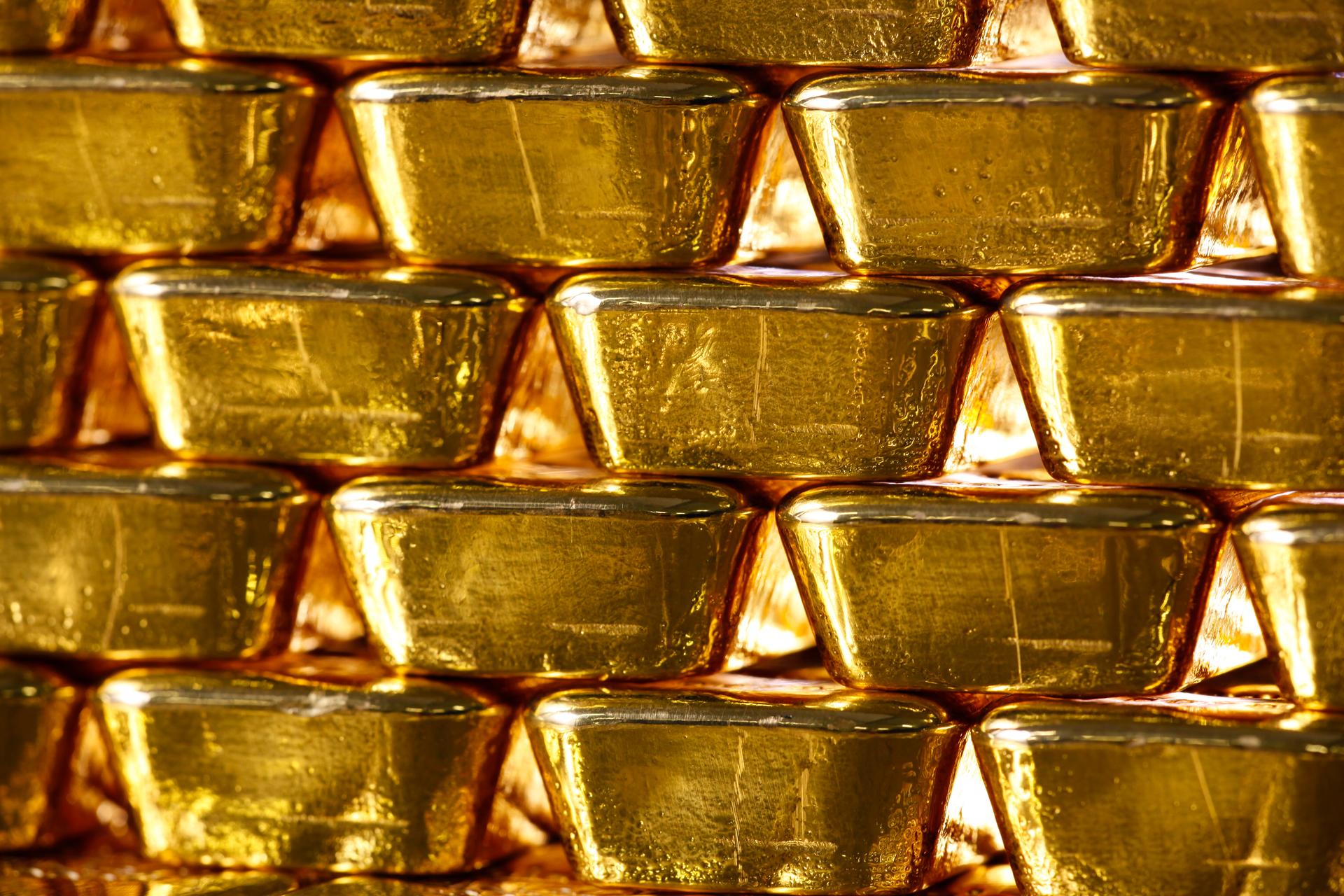 A striking image of gold bars representing custody services in asset management, highlighting security and wealth.
