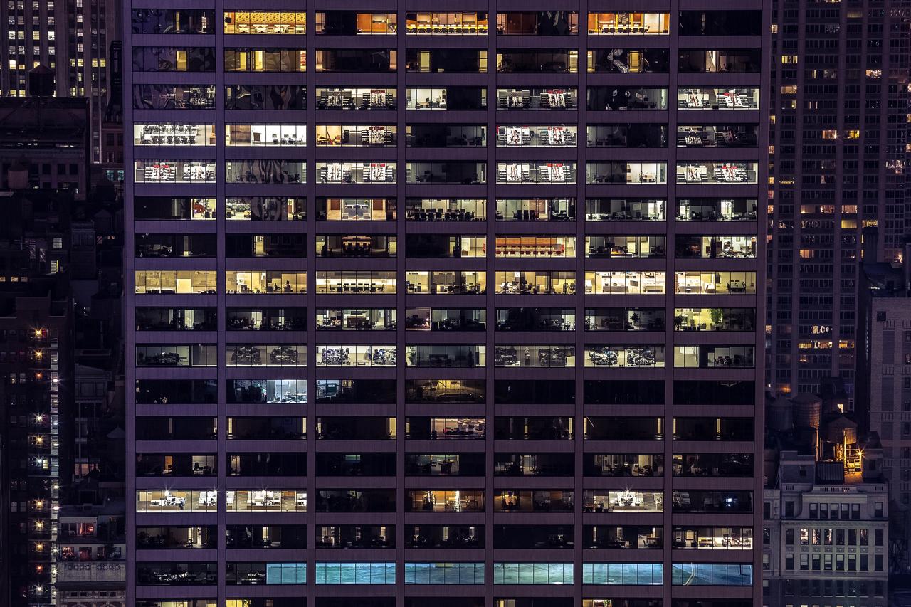 Exterior shot of a multi-family house at night.