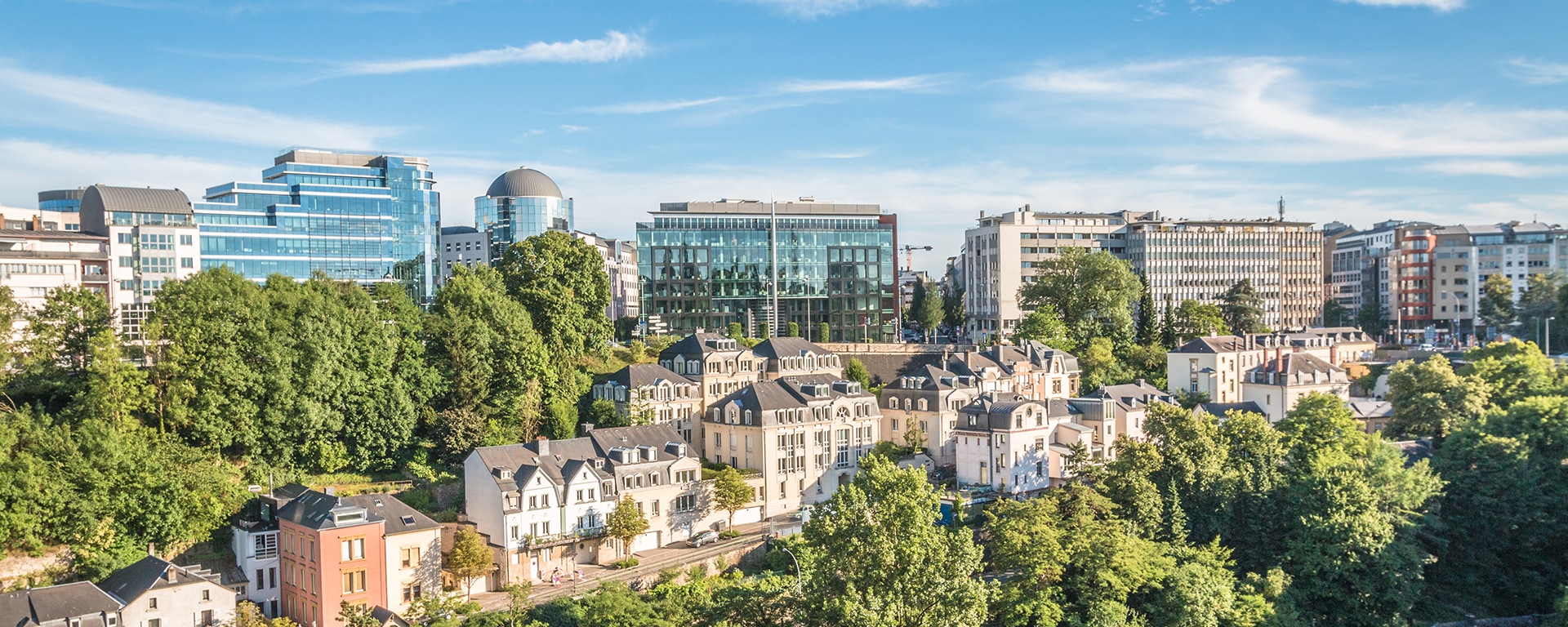 A view of part of Luxembourg city with houses and the financial district in the background