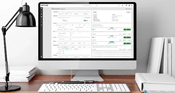Desktop setup with a monitor displaying the derinet trading platform interface, showing product structuring and order details on a clean, modern workspace.
