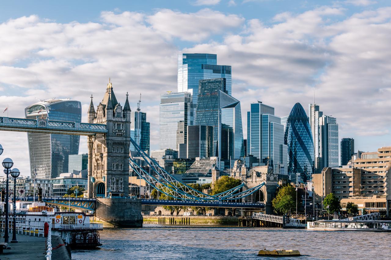 A photo of Londons financial district showing the Thames, London Bridge and high-rise buildings