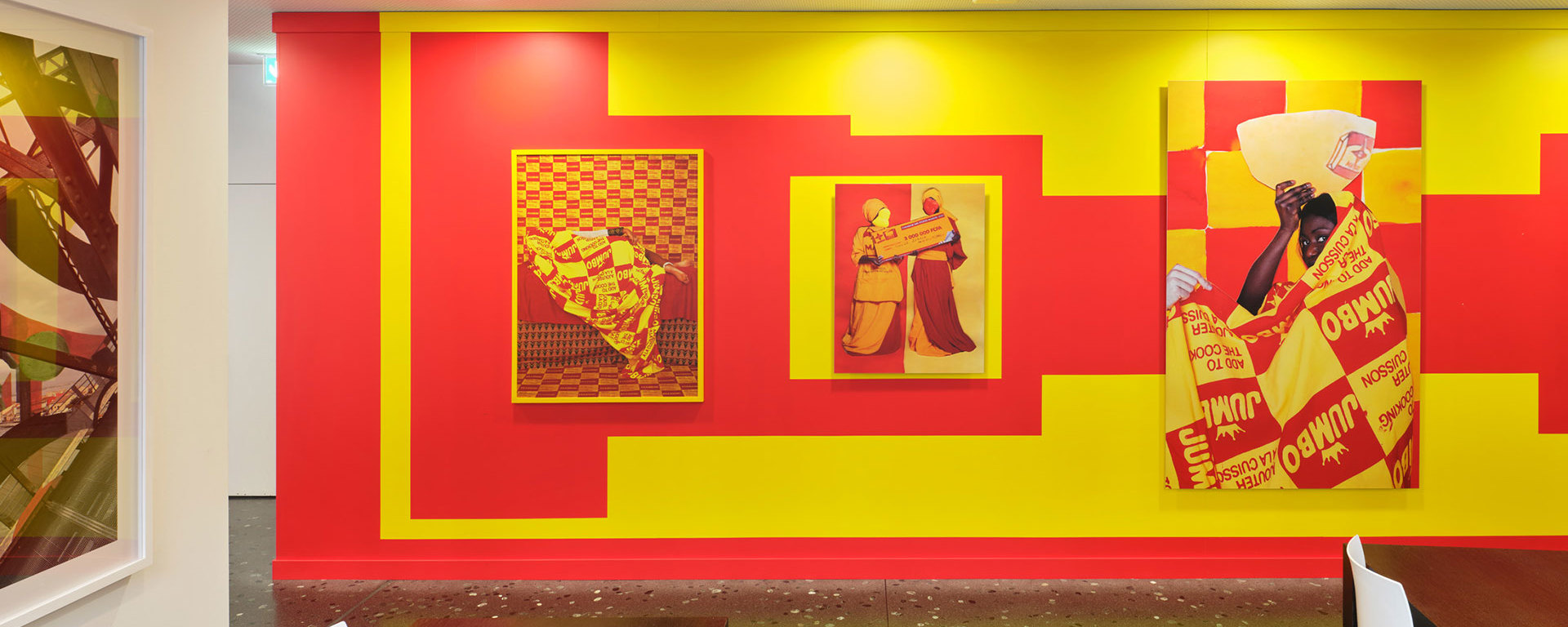 Art Vontobel - Photo wall in red and yellow with a photo series in the staff restaurant