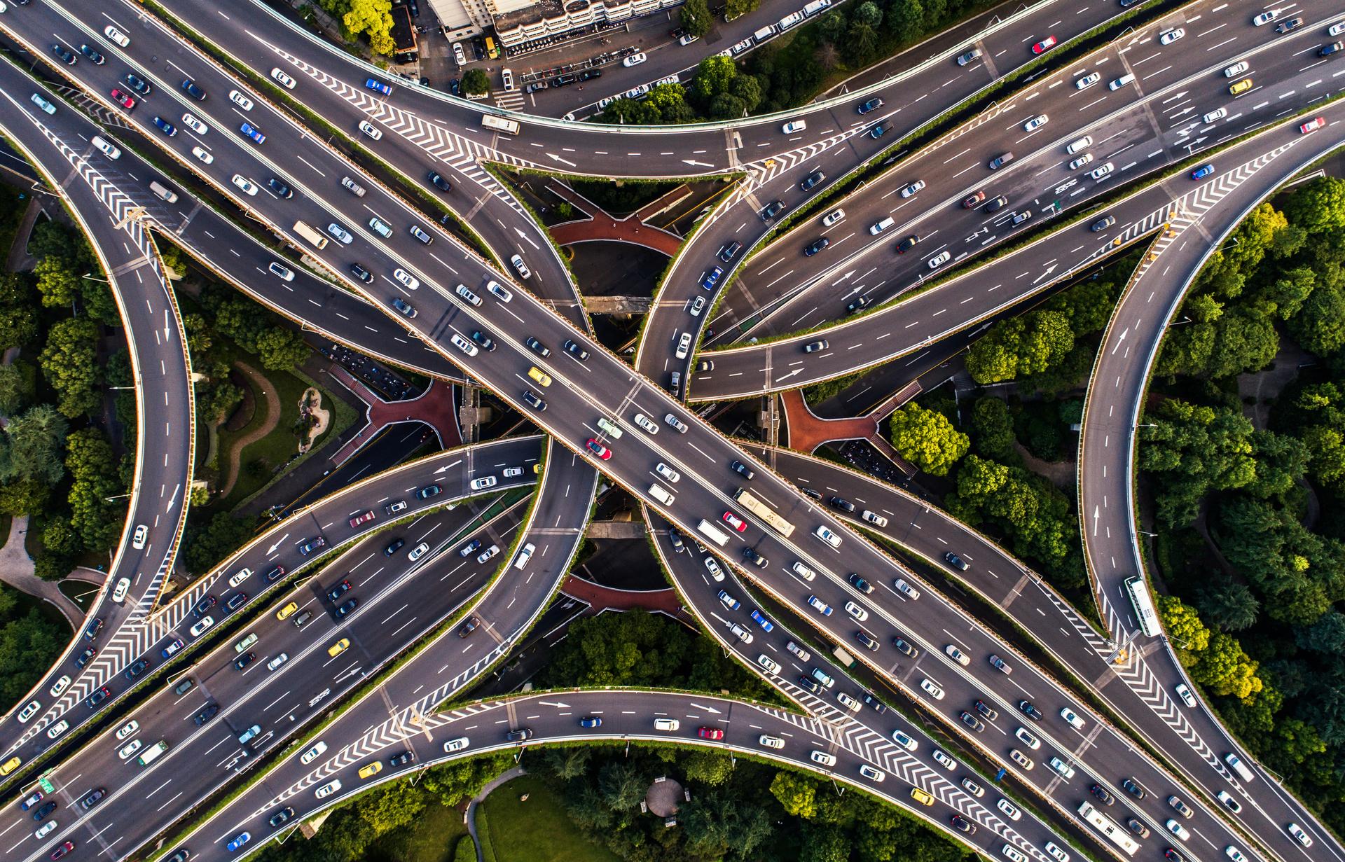 A photo of a busy highway from an aerial perspective.
