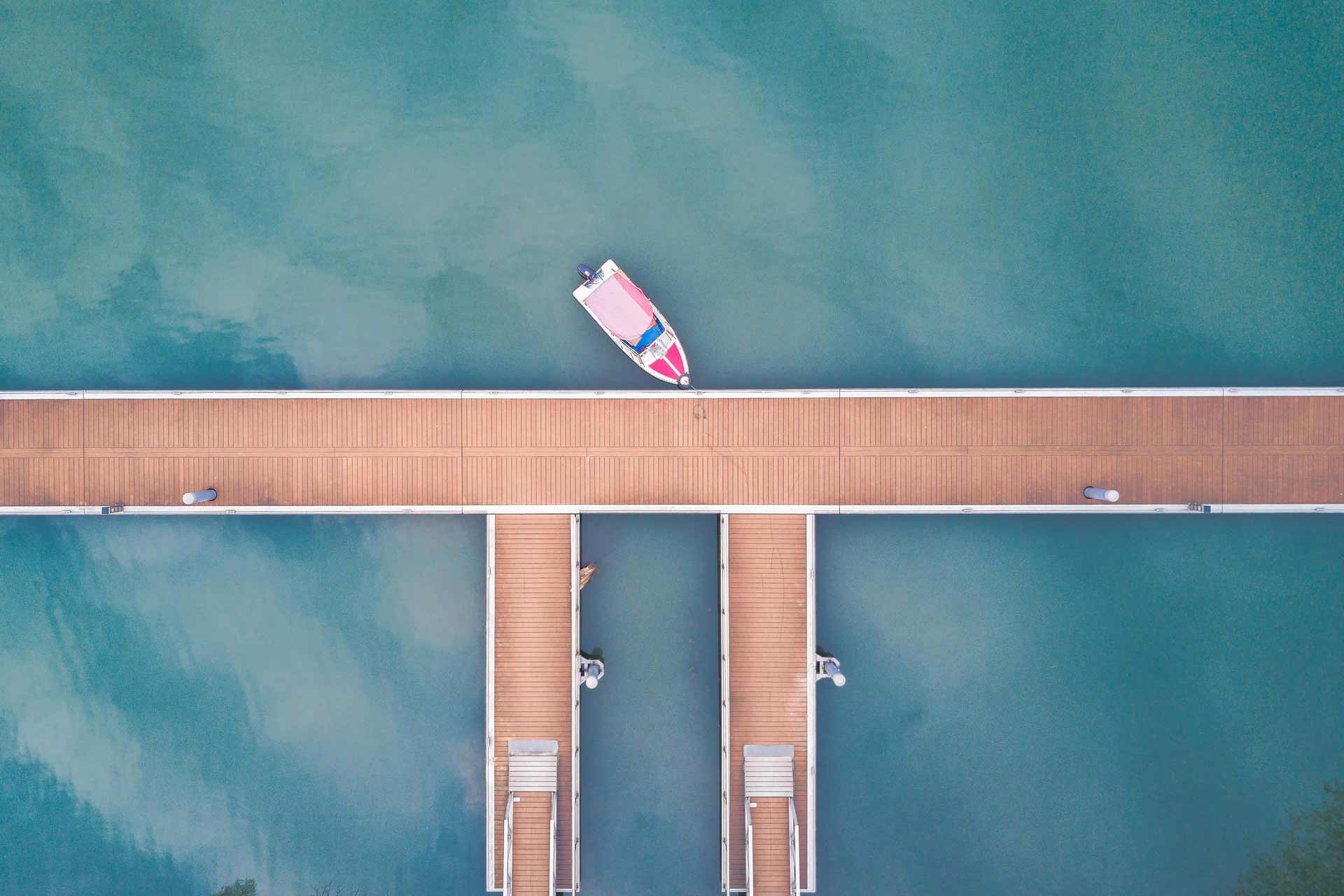 Bird's eye view from a boat moored to a wooden jetty